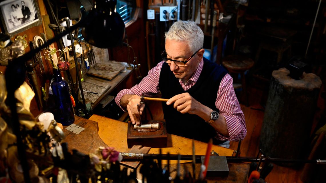 Craftsman Juan Carlos Pallarols, pictured at his workshop in Buenos Aires on November 1. He displays a model presidential baton, like the one that will be given to Argentina’s next president on December 10. 