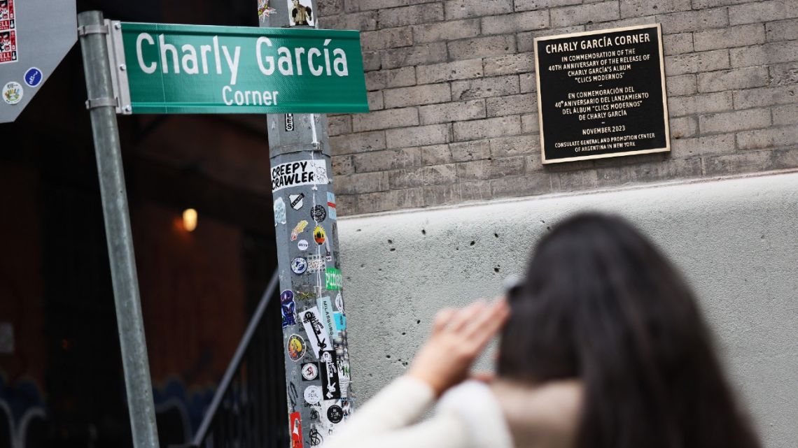 aura Maldonado, who is visiting from Argentina, photographs a street sign for Musician Charly García on November 7, 2023 in New York City. García was honoured with a street sign and corner dedication on November 6 at the intersection of Walker Street and Cortlandt Alley in the Tribeca neighbourhood. His album 'Clics Modernos,' which was released 40 years ago, is considered a masterpiece of national and Latin American rock. A photo taken by photographer Uberto Sagramoso in that corner became the cover art of the album. 