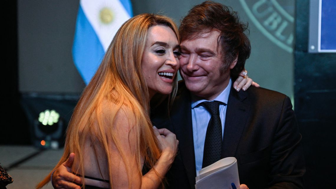Javier Milei celebrates with his girlfriend Fatima Flórez after winning the presidential election run-off at his party headquarters in Buenos Aires on November 19, 2023. 