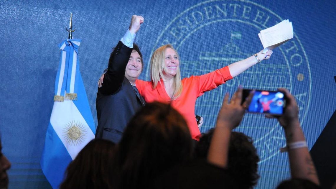 Javier Milei and his sister, campaign manager Karina Milei, celebrate his election onstage at the La Libertad Avanza bunker in downtown Buenos Aires.