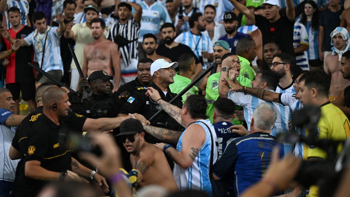 Fans of Argentina are attacked by Brazilian police before the start of the 2026 FIFA World Cup South American qualification football match between Brazil and Argentina at Maracanã Stadium in Rio de Janeiro, Brazil, on November 21, 2023. 
