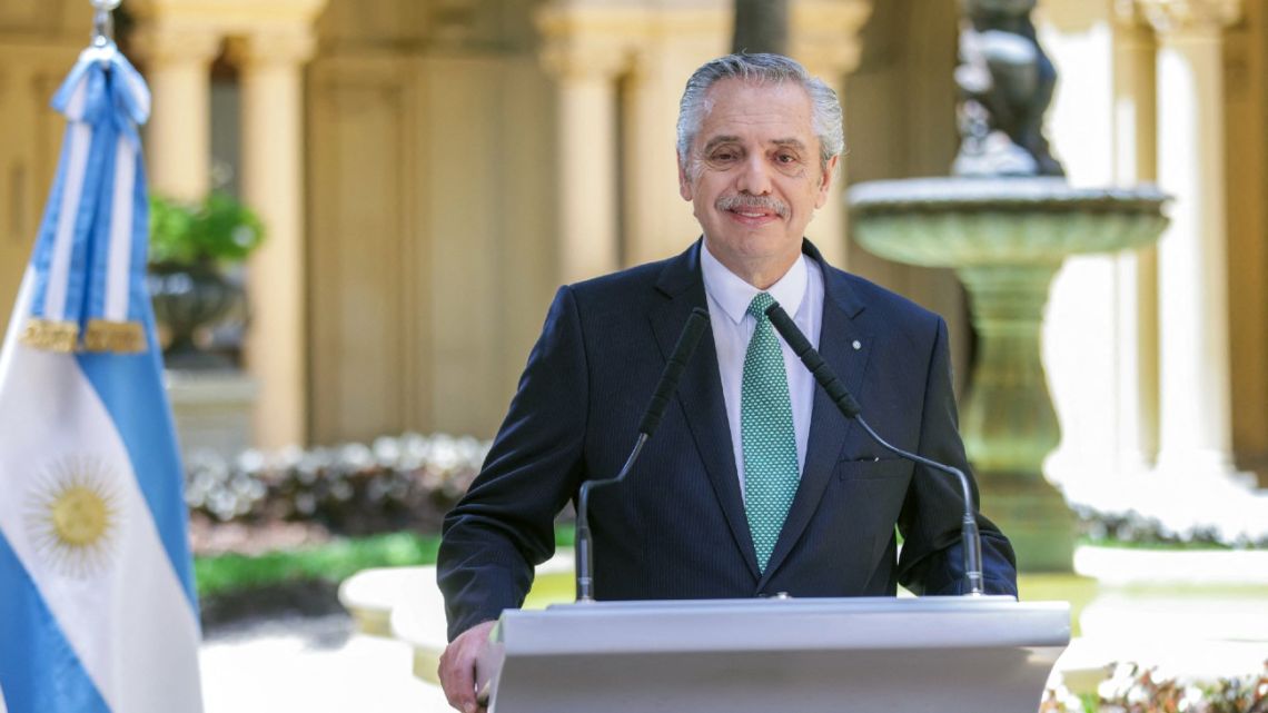 Handout picture released by the Presidency shows President Alberto Fernández addressing the nation in his last speech as head of state.