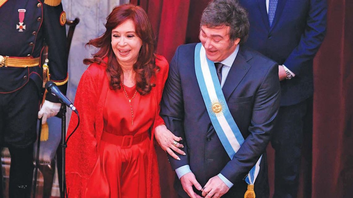 Cristina Fernández de Kirchner and Javier Milei share a laugh during the latter's inauguration as head of state.