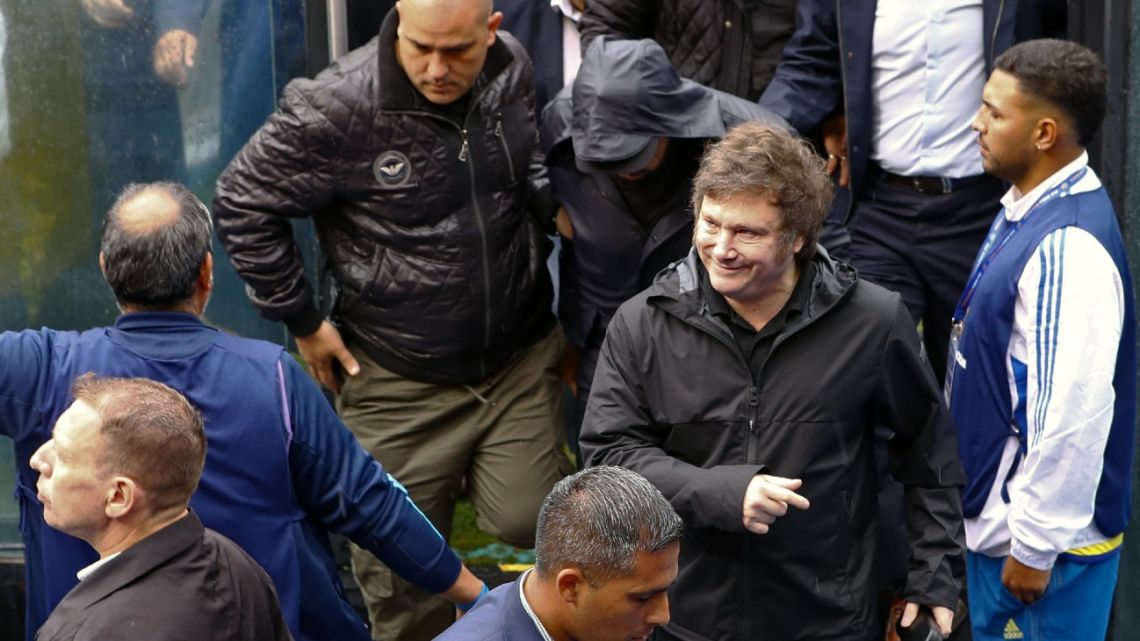Argentina's President Javier Milei (2nd R) leaves after voting during the elections in Boca Juniors football club, at La Bombonera stadium, in Buenos Aires, Argentina, on December 17, 2023. 