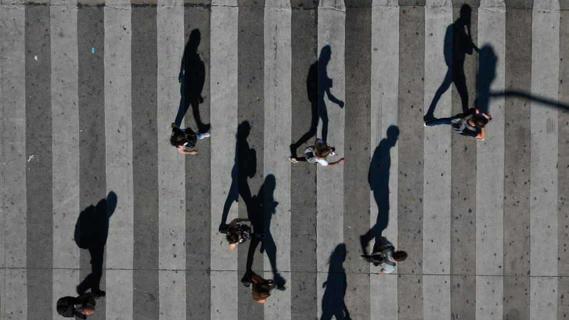Aerial view of the shadow of people walking on a street in Buenos Aires, on January 9, 2024.
