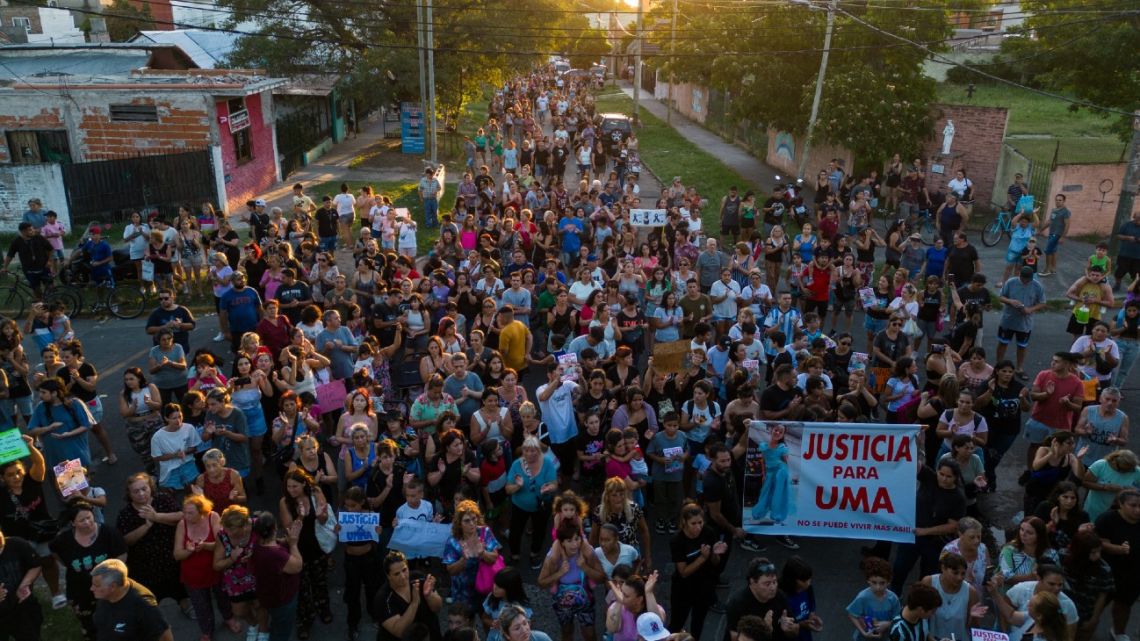 In this aerial view, people march asking for justice after the murder of nine-year-old girl Umma Aguilera, the daughter of a police guard of Security Minister Patricia Bullrich, in Lomas de Zamora, Buenos Aires Province, on January 23, 2024. 