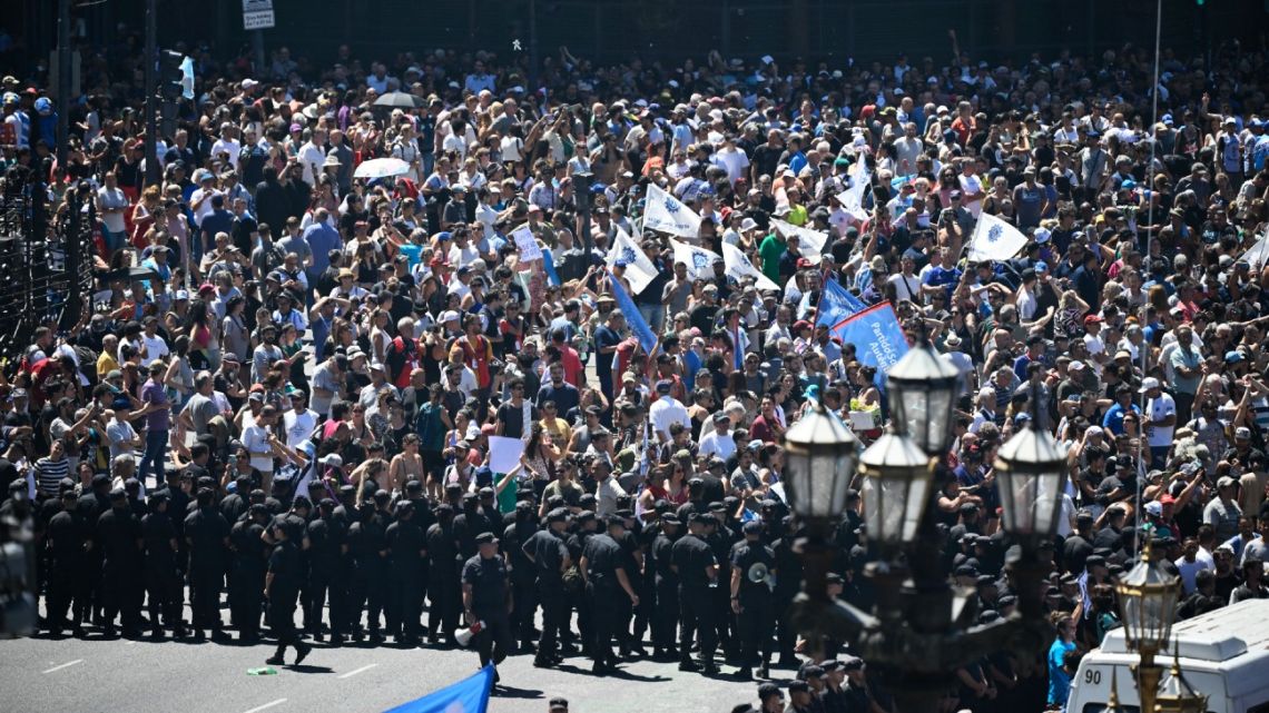 People take part in a demonstration outside Congress during a national strike against the government of Javier Milei in Buenos Aires, on January 24, 2024. 