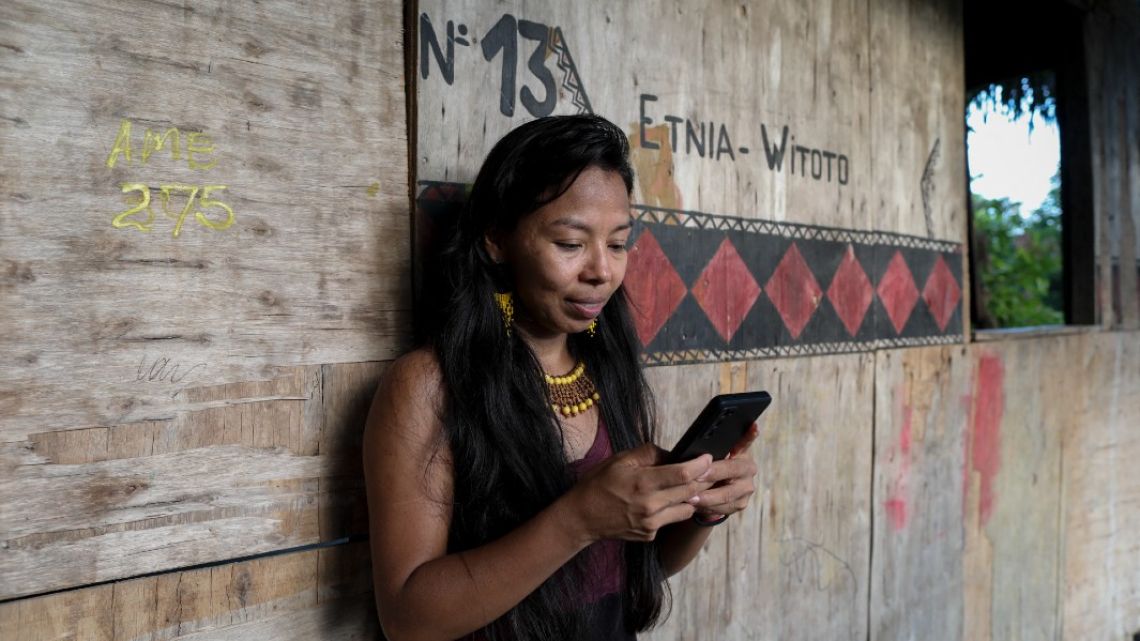 Witoto’s Indigenous leader and teacher, Vanda Witoto, writes a message using the app Linklado in Manaus, Amazonas State, northern Brazil, on January 24, 2024.