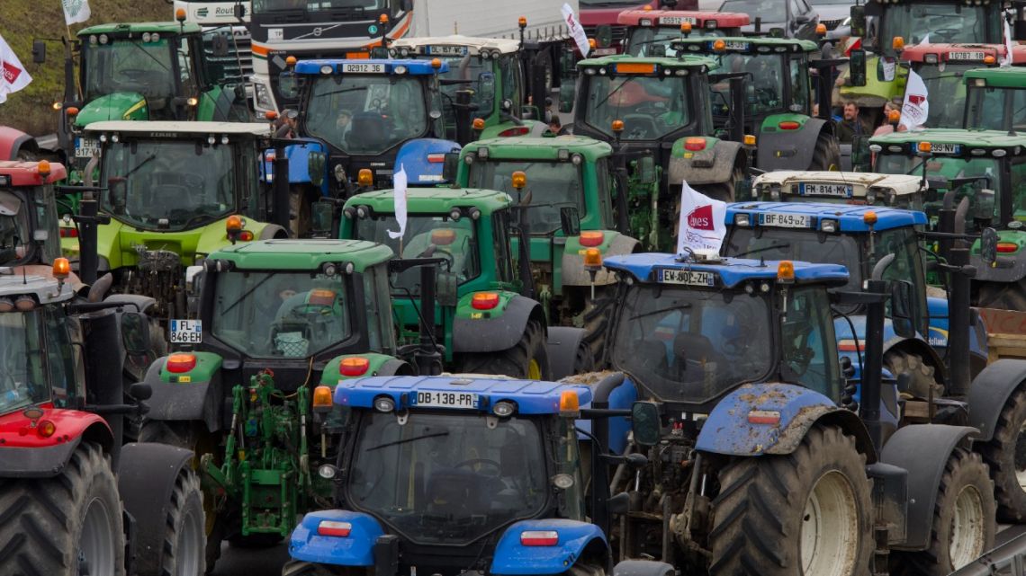 Farmers block the Bourges' exit on the A71 highway to protest over taxation and declining income, on January 24, 2024.