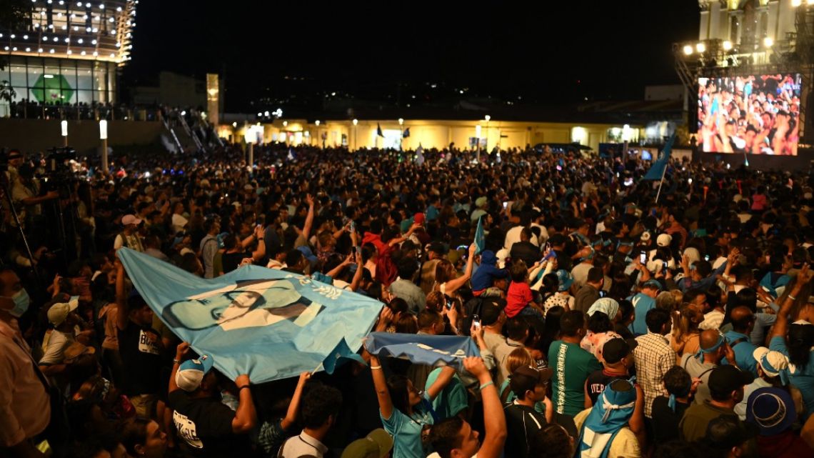 Supporters of Salvadoran President Nayib Bukele celebrate after the presidential and legislative elections in San Salvador on February 4, 2024.