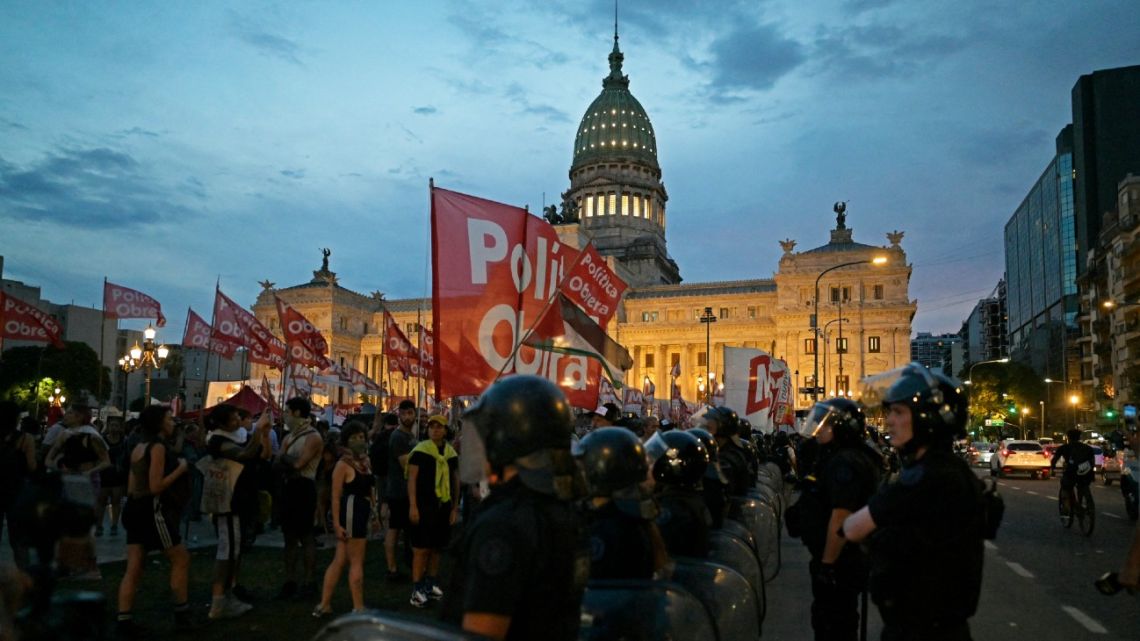 Demonstrators gather outside the Congress while Argentine lawmakers debate on President Javier Milei's controversial ultra-liberal bill of economic reforms in Buenos Aires on February 6, 2024.