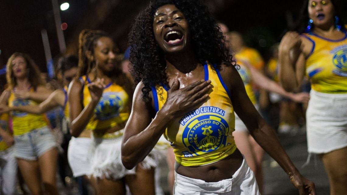 Members of the Paraiso do Tuiuti samba school dance during the street rehearsal ahead of the 2024 traditional Carnival parade in Rio de Janeiro, Brazil, on January 30, 2024.