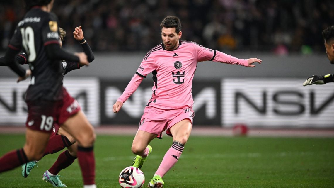 Inter Miami's Argentine forward Lionel Messi (C) kicks the ball during the second half of the friendly football match between Inter Miami of the US's Major League Soccer league and Vissel Kobe of Japan's J-League at the National Stadium in Tokyo