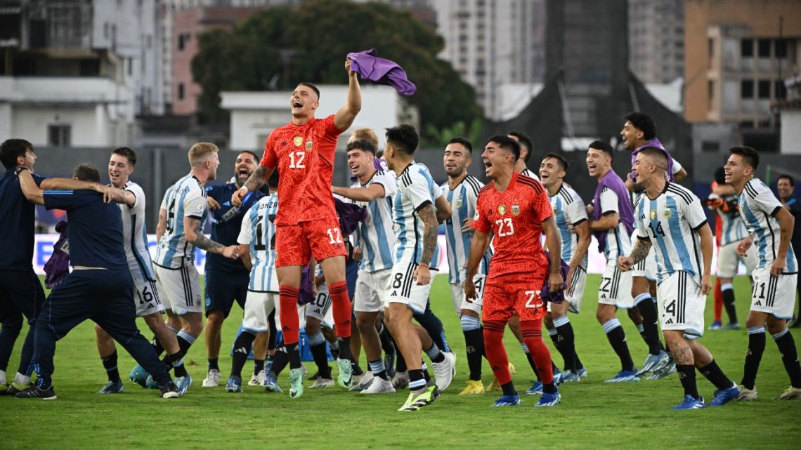 Argentina's U23 players celebrate after defeating Brazil and qualifying for the 2024 Paris Olympic Games during the Venezuela 2024 CONMEBOL Pre-Olympic Tournament football match between Brazil and Argentina at the Brigido Iriarte stadium in Caracas on February 5, 2024. 