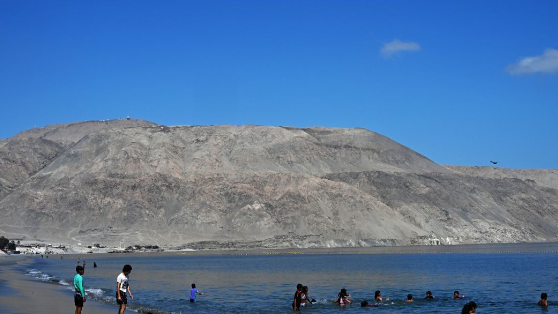 People enjoy the beach in Mejillones, Antofagasta Region, Chile, on January 25, 2024.