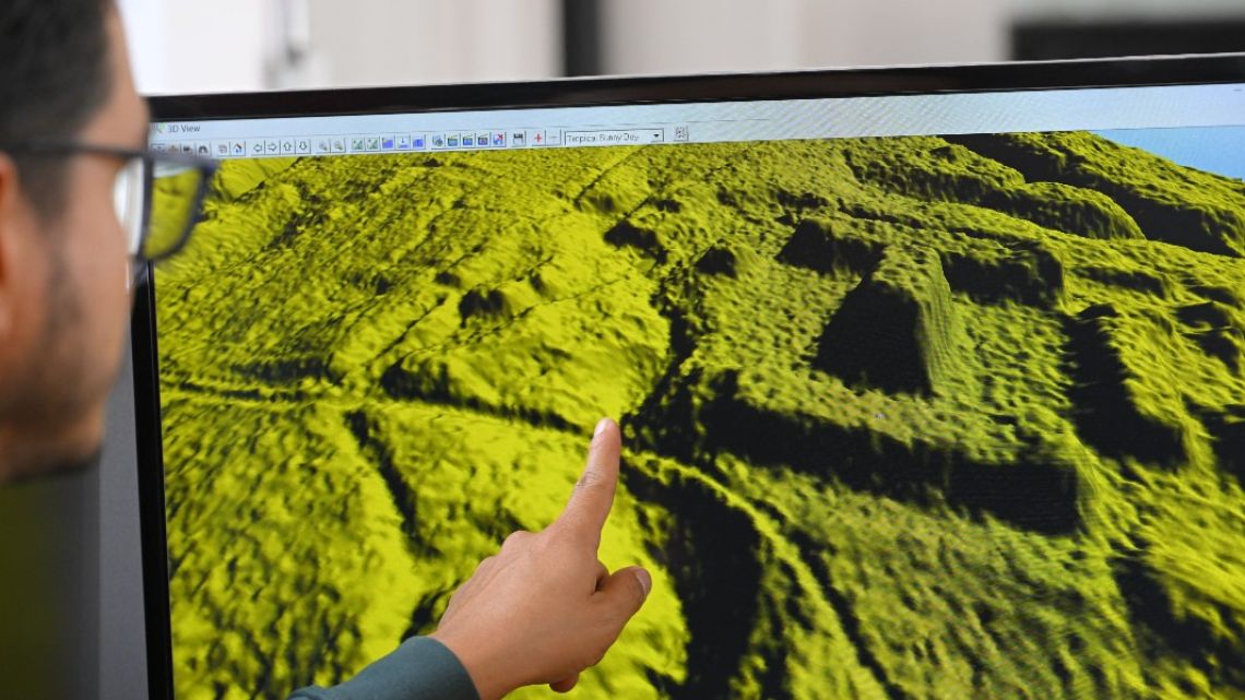 Geomatics analyst at the Institute of Cultural Heritage, Leonardo Auz, shows a digital representation of the relief of an area near the Upano River in the Ecuadorian Amazon