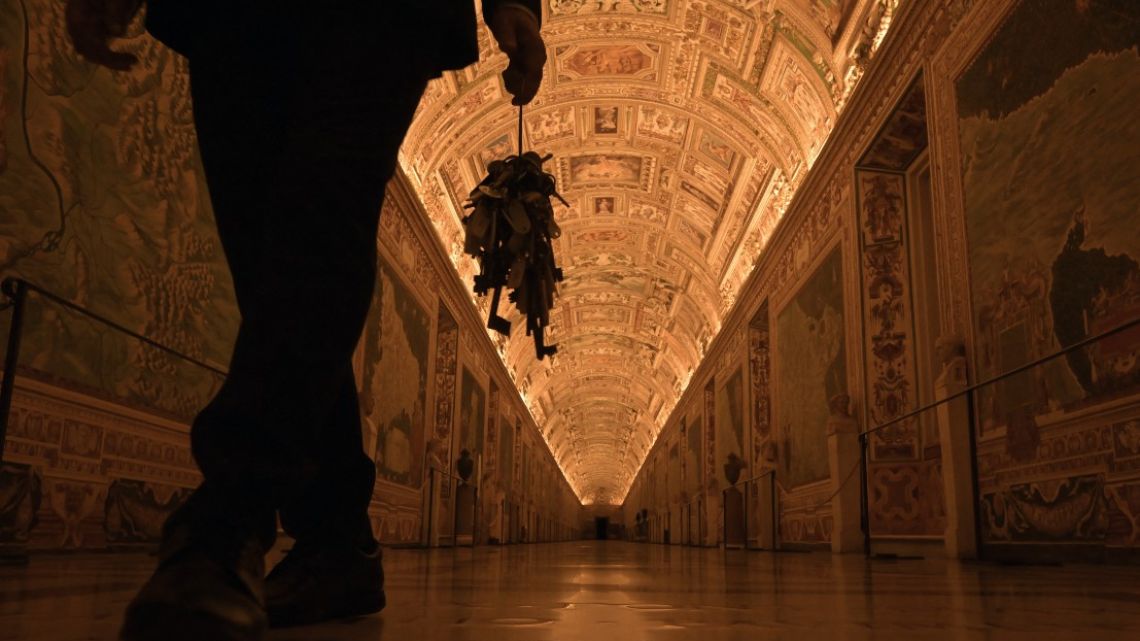 Gianni Crea, key keeper of the Vatican Museums, holds a big mast of keys as he walks in a gallery during a private visit of the museums by night, on February 13, 2024.