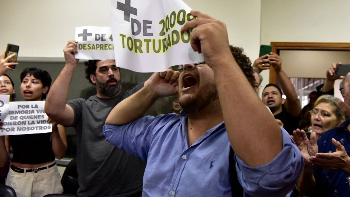 Human rights activists celebrate the sentencing of retired police commissioner Eusebio Torres for the torture of victims of the dictatorship of General Alfredo Stroessner (1954–1989)  at the Palace of Justice in Asunción on February 20, 2024