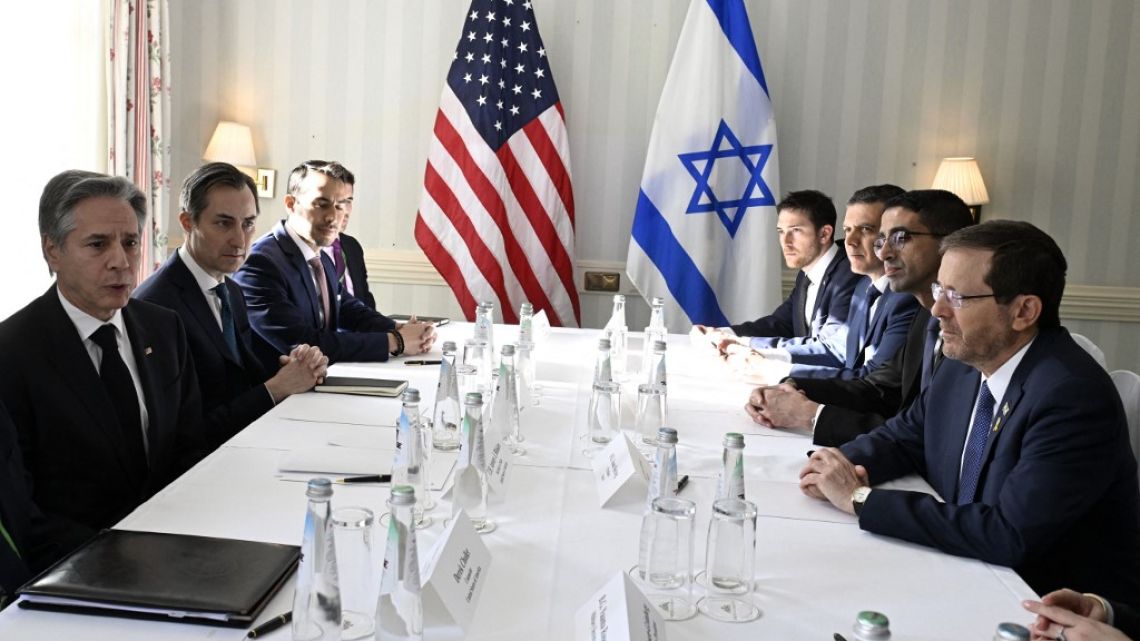 US Secretary of State Antony Blinken (L), Israeli President Isaac Herzog (R) and members of their delegations have taken their seats for a bilateral meeting during the Munich Security Conference (MSC) in Munich, southern Germany on February 17, 2024.