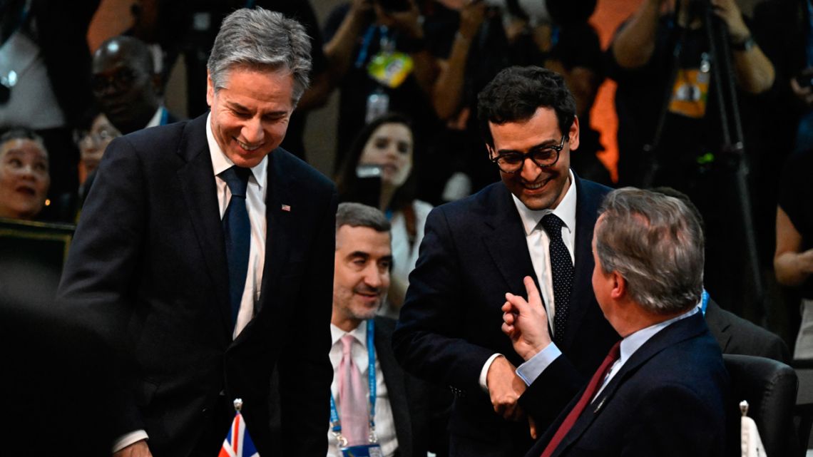US Secretary of State Antony Blinken (left), France's Minister for Foreign and European Affairs Stéphane Séjourné (centre), and Britain's Foreign Secretary David Cameron (right) share a light moment during the G20 foreign ministers meeting in Rio de Janeiro, Brazil, on February 21, 2024.