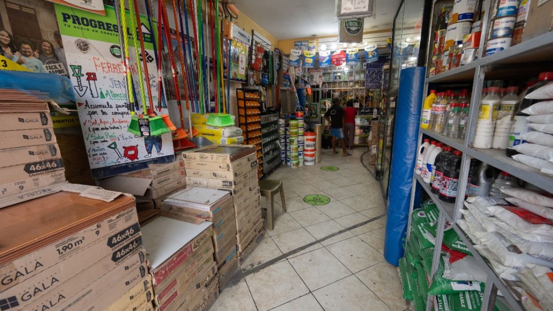 A family-owned hardware store remains open even after receiving multiple threats from racketeers attempting to intimidate the owner into paying for protection in the populous district of Lurigancho in Lima on January 29, 2024.
