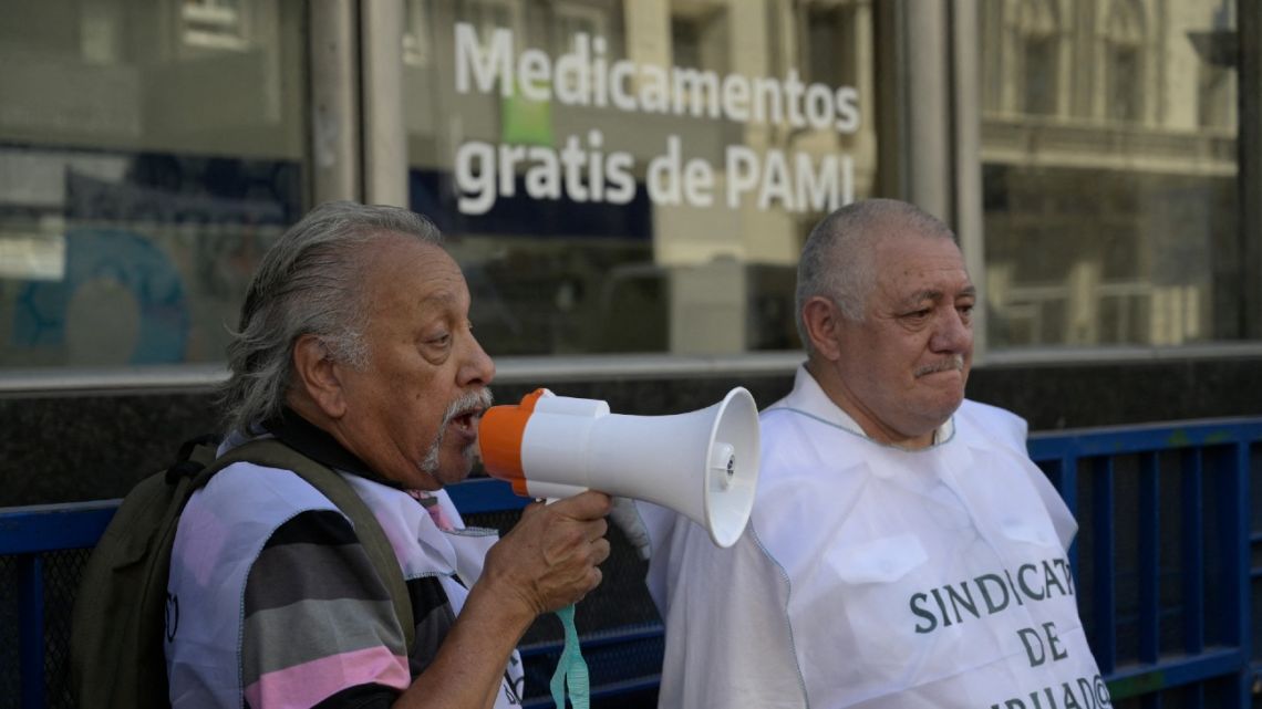 Retirees take part in a demonstration from the Obelisk to the PAMI (Comprehensive Medical Attention Programme) public health insurance agency in Buenos Aires, on February 21, 2024.
