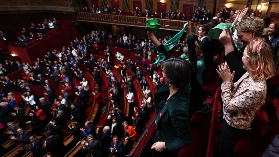 Senators applaud after President of the National Assembly Yael Braun-Pivet announced the result of the vote during the convocation of a congress of both houses of parliament in Versailles, southwestern of Paris, on March 4, 2024, to anchor the right to abortion in the country's constitution. 