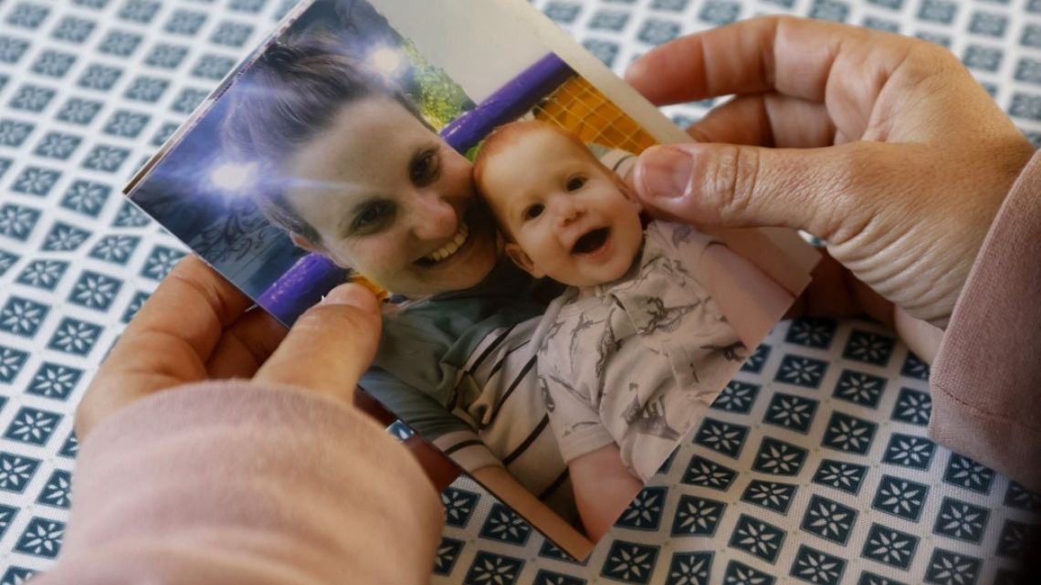 Ofri Bibas Levi, the sister in law of Israeli hostage kidnaped during the October 7 attack in southern Israel Shiri Bibas, holds a family picture of Bibas and one of her two boys