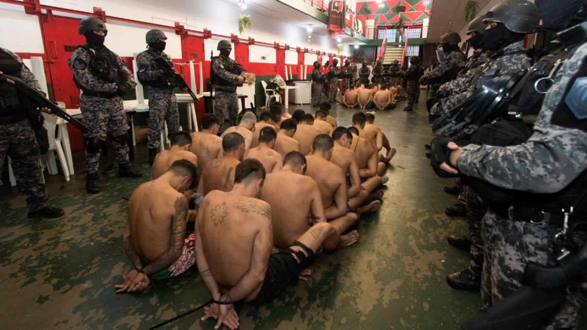 Handout pictures released by Santa Fe Province government shows inmates being guarded by members of the Special Penitentiary Operations Group (GOEP) while carrying out a search at Penitentiary Unit Nº 11 in Piñero, near Rosario, on March 5, 2024.