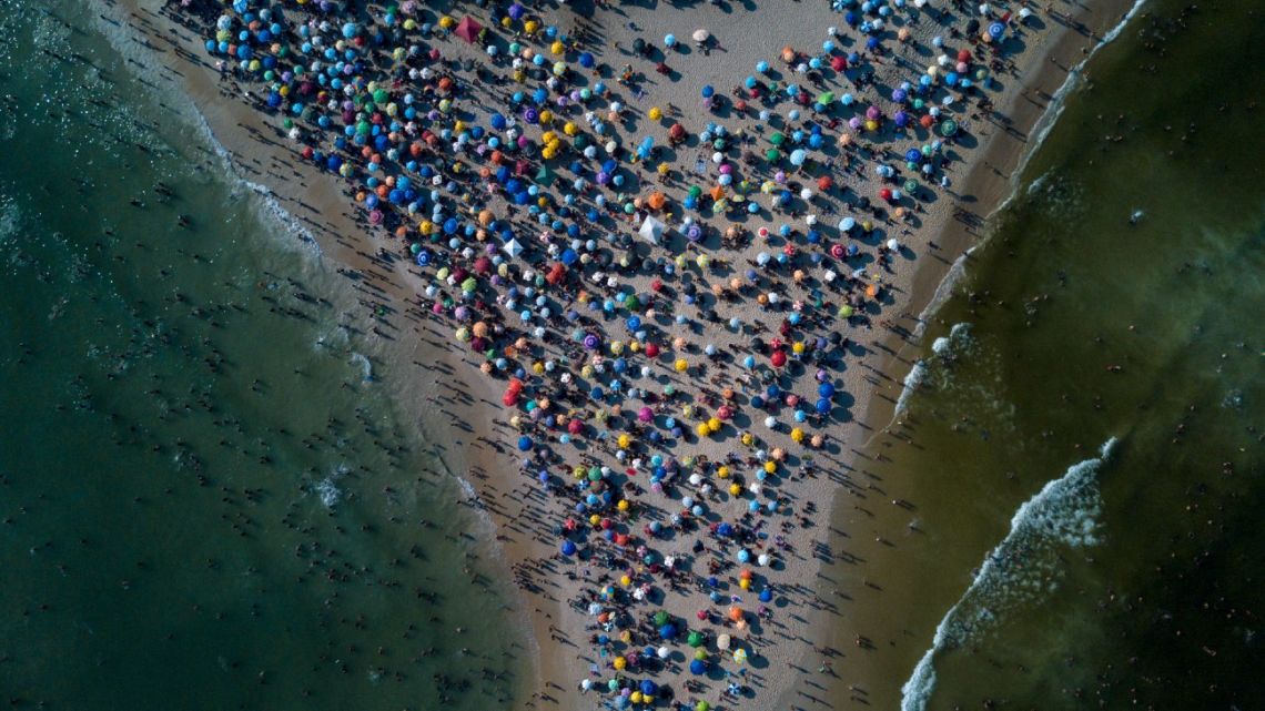 Aerial view of people enjoying Recreio dos Bandeirantes beach amid a heat wave in Rio de Janeiro, Brazil, taken on March 17, 2024. 