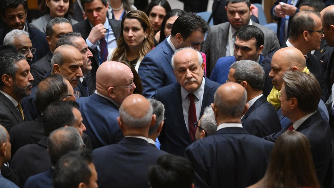 Palestinian Ambassador to the United Nations Riyad Mansour (centre) arrives for a United Nations Security Council meeting on the situation in the Middle East, at the UN headquarters in New York on March 25, 2024. 