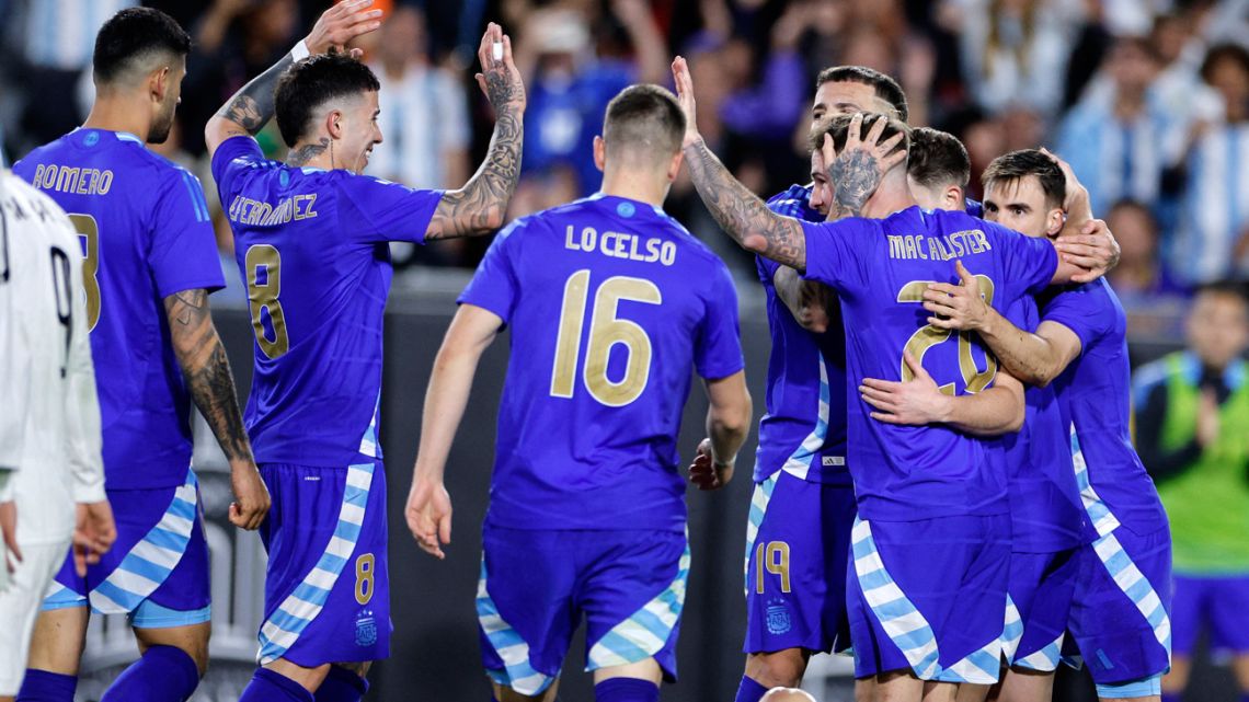 Alexis Mac Allister of Argentina celebrates with his teammates after scoring their second goal against Costa Rica during the second half of their friendly match at United Airlines Field at the Los Angeles Memorial Coliseum on March 26, 2024 in Los Angeles, California.