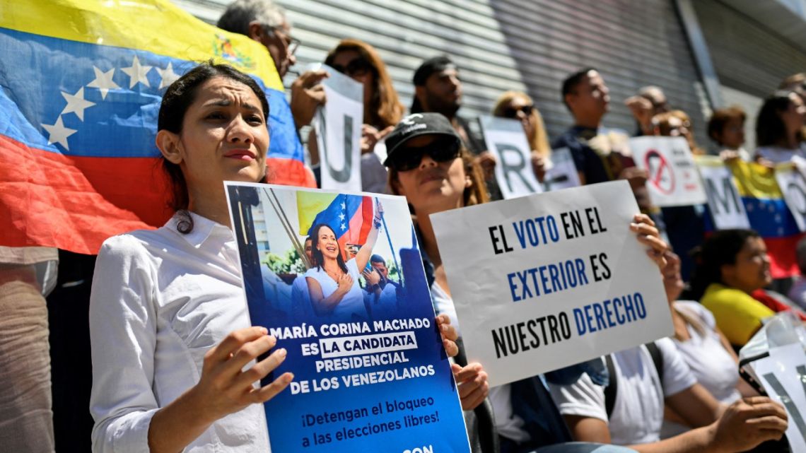 Venezuelans in Argentina protest outside the Venezuelan Embassy in Buenos Aires on March 25, 2024, calling for the electoral registry to be enabled so they could vote in the upcoming July 28 presidential elections in Venezuela.