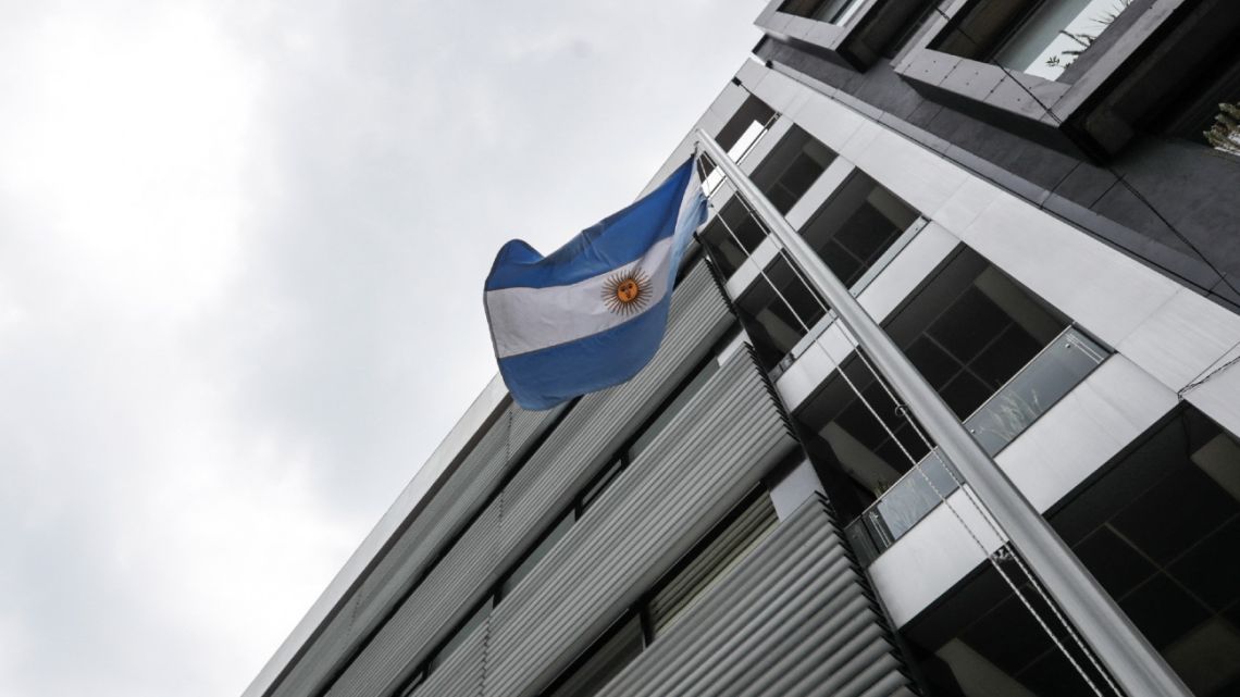 View of the Argentine national flag and the façade of the building where the Embassy operates in Bogotá, taken on March 28, 2024. 