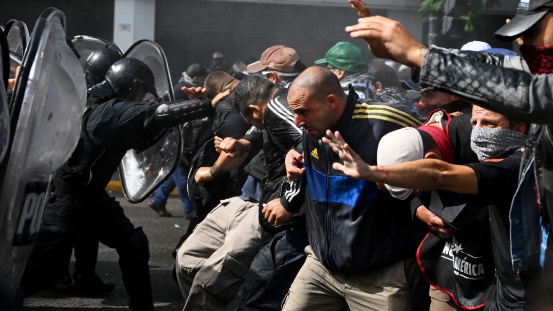 Police clash with demonstrators in Buenos Aires protesting against the recent economic measures introduced by the government of President Javier Milei in Buenos Aires, on April 10, 2024. 