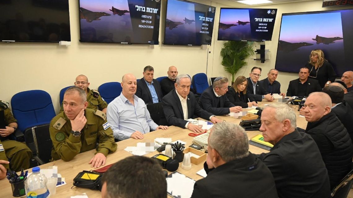 This handout picture courtesy of the Israeli Prime Minister's Office taken on April 14, 2024 shows Israel's Prime Minister Benjamin Netanyahu (C) during a War Cabinet meeting at the Kirya in Tel Aviv. Iran's Revolutionary Guards confirmed early April 14, 2024 that a drone and missile attack was under way against Israel in retaliation for a deadly April 1 drone strike on its Damascus consulate. 