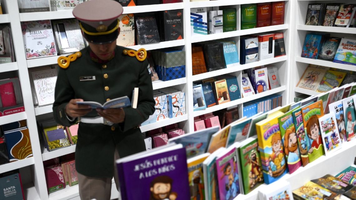 A cadet of the Argentine Gendarmerie reads a book at the 48th Buenos Aires International Book Fair on April 25, 2024.
