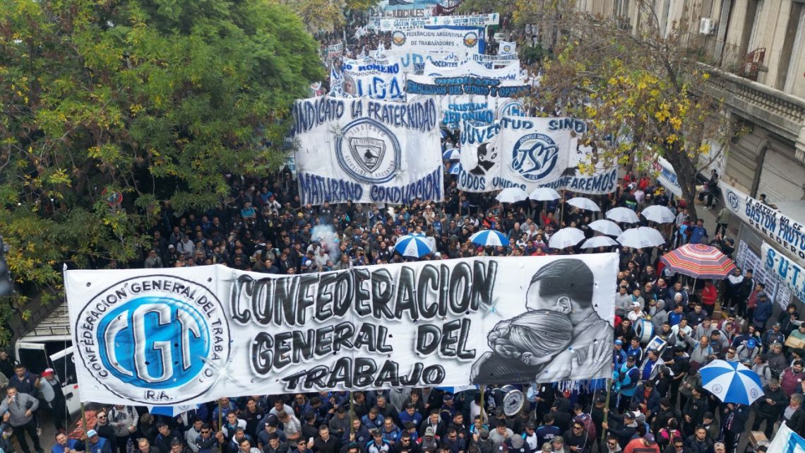 In this aerial view members of labor organisations hold placards as they march during a demonstration marking International Workers' Day (May Day, Labour Day) in Buenos Aires on May 1, 2024. 