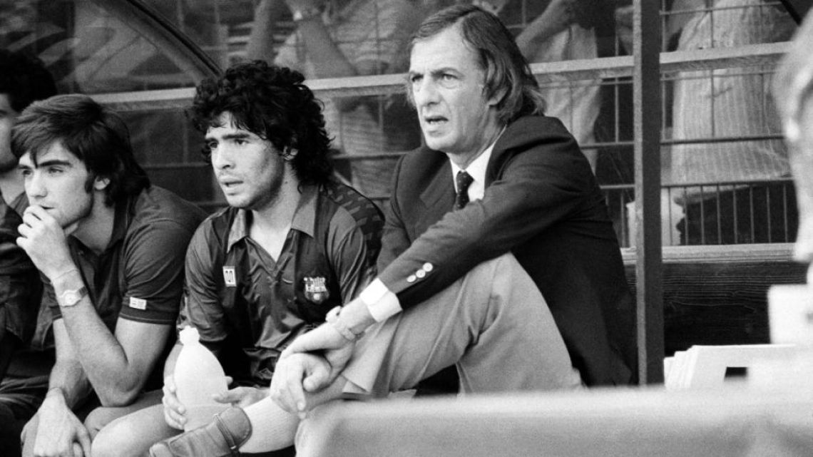 César Luis Menotti, pictured during his time coaching Barcelona, with Diego Maradona among those seated on the bench alongside him.