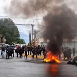 Protesters in Posadas, Misiones Province, block streets as they demonstrate in demand of better pay.