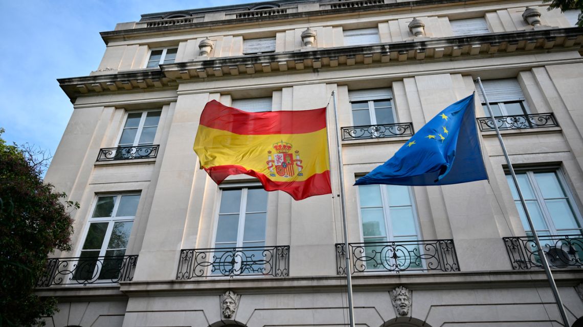 Spanish and European Union flags fly at the Spanish Embassy in Buenos Aires on May 20, 2024. 