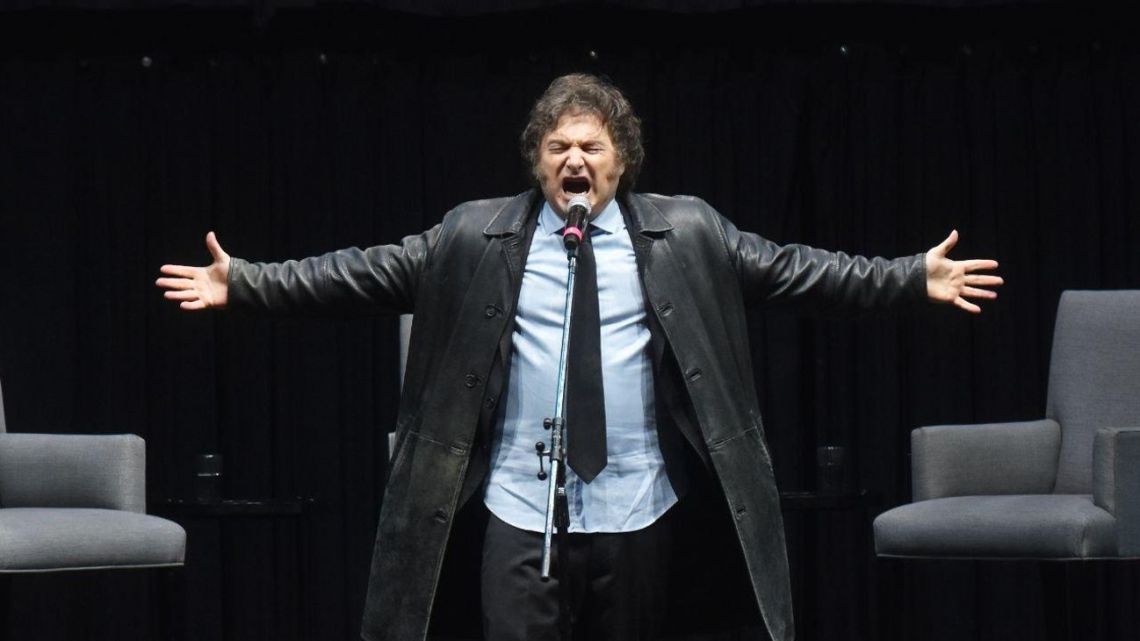 President Javier Milei sings at an event promoting his latest book, at Luna Park stadium, on May 22, 2024.