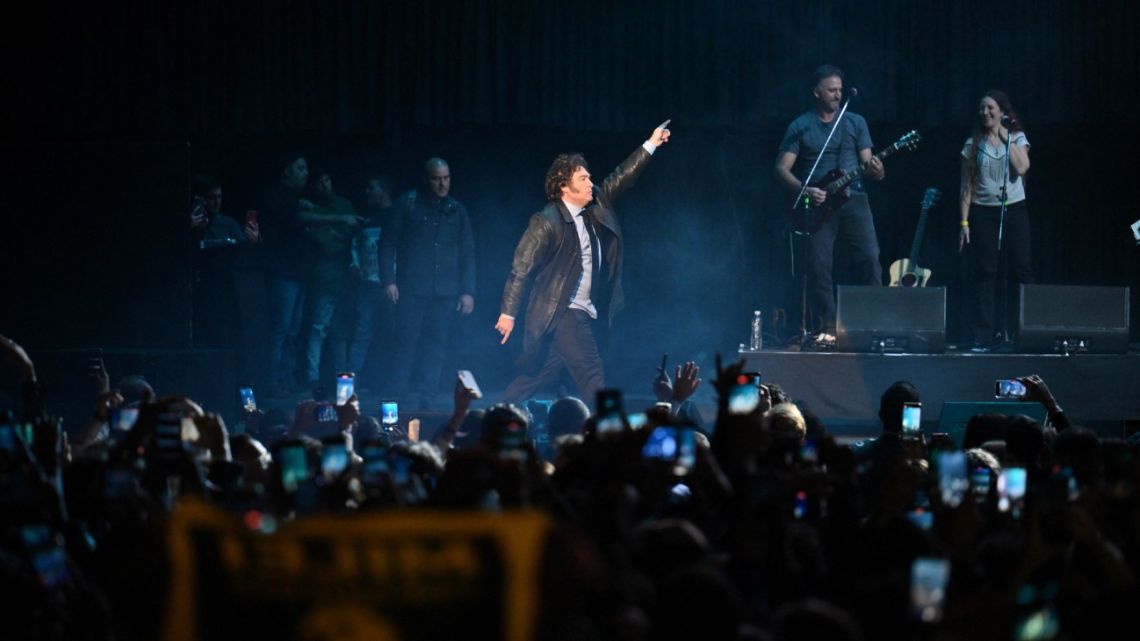President Javier Milei dances during the presentation of his new book at the Luna Park stadium in Buenos Aires on May 22, 2024. 