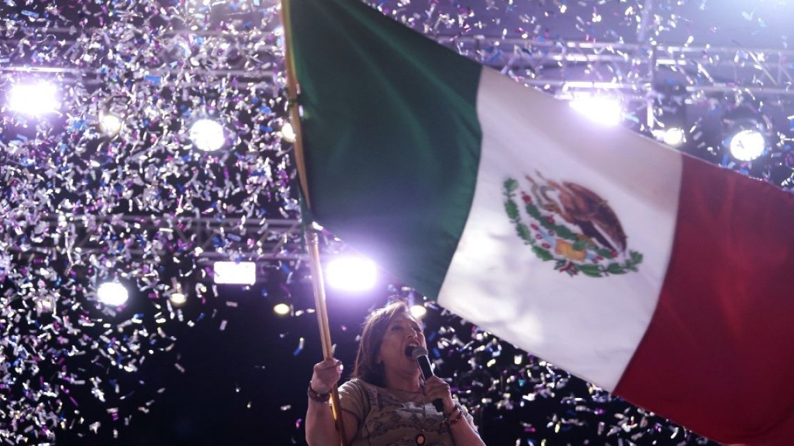Mexican opposition presidential candidate Xochitl Galvez waves a Mexican flag during a campaign rally in Ciudad Guzman, Jalisco, Mexico May 27, 2024.
