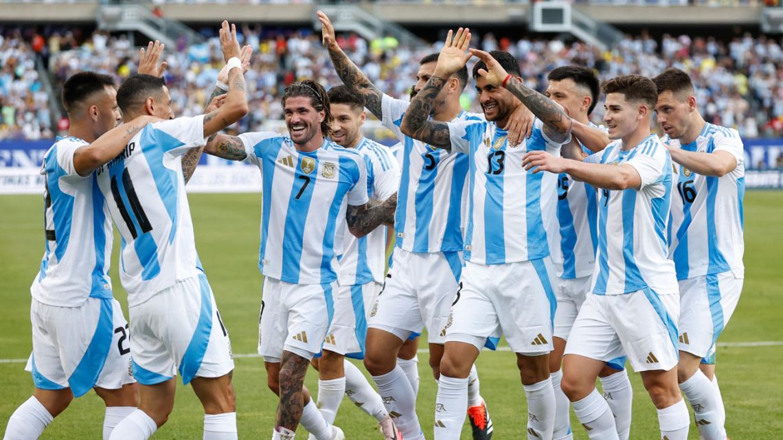 Argentina's forward #11 Ángel Di María celebrates scoring his team's first goal with teammates during an international friendly football match between Argentina and Ecuador at Solider Field in Chicago, Illinois, on June 9, 2024. 