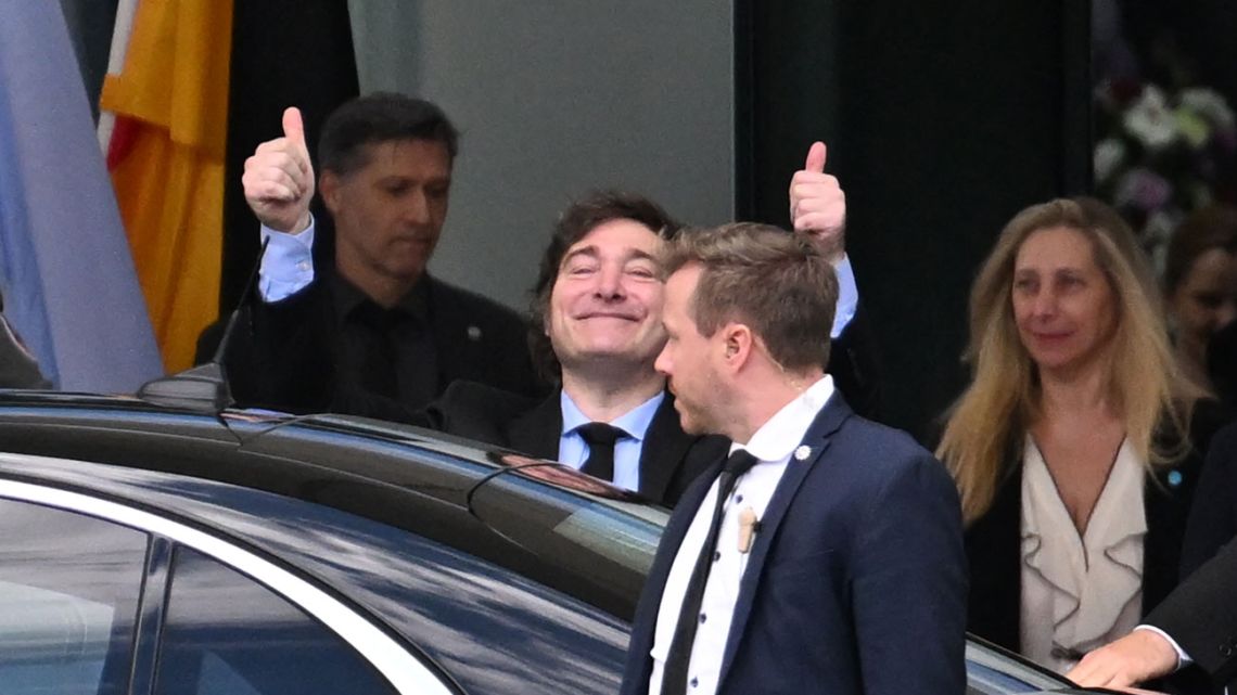 President Javier Milei waves to supporters as he and his sister, presidential chief-of-staff Karina Milei, leave the German Chancellery after a meeting with German Chancellor Olaf Scholz in Berlin, Germany on June 23, 2024. 