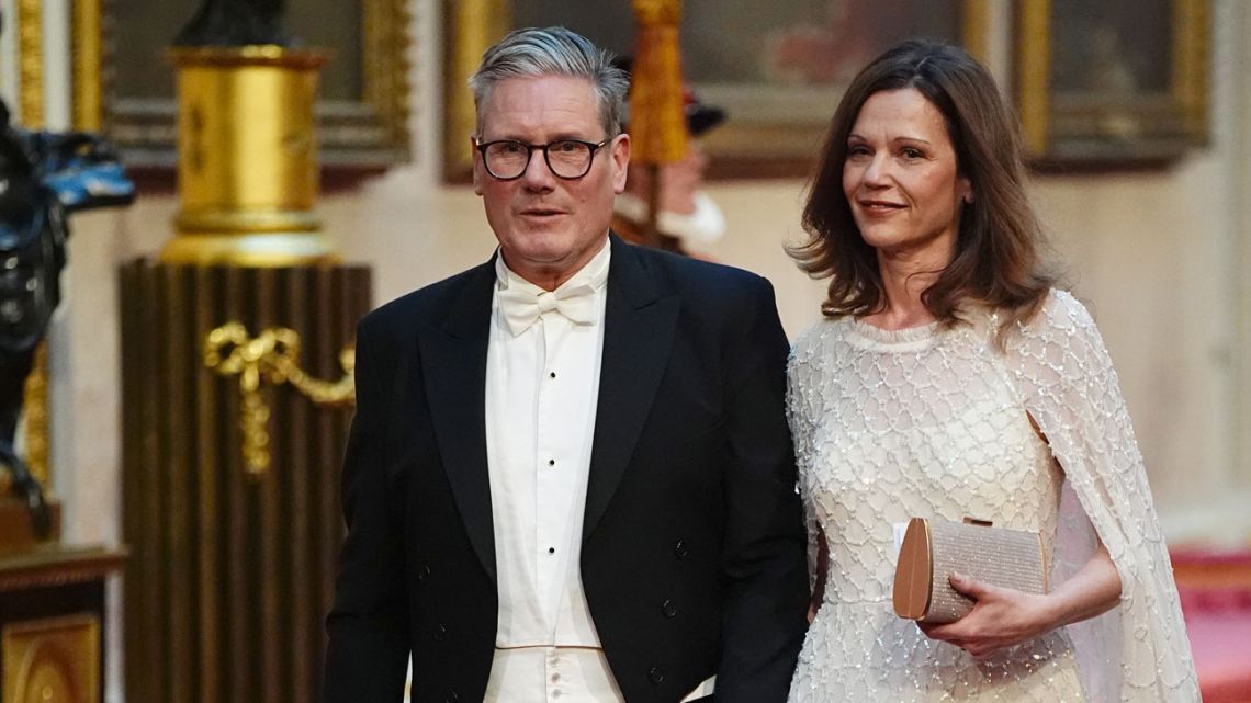 Labour leader Sir Keir Starmer with his wife Victoria make their way along the East Gallery to attend a State Banquet at Buckingham Palace in London on June 25, 2024, on the first day of a three-day State Visit by Japan's Emperor and Empress to Britain. The Japanese royal couple arrived in Britain for a three-day state visit hosted by King Charles III.