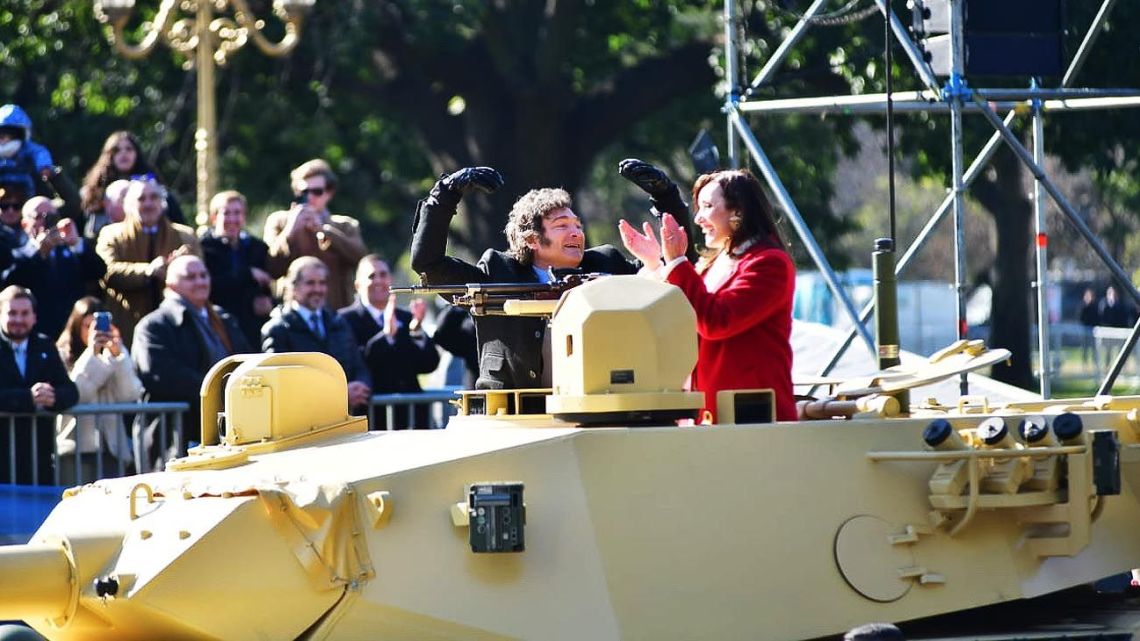 President Javier Milei jumps into a tank with Vice-President Victoria Villarruel as he stages a military parade in Buenos Aires to mark the 208th anniversary of Independence Day.