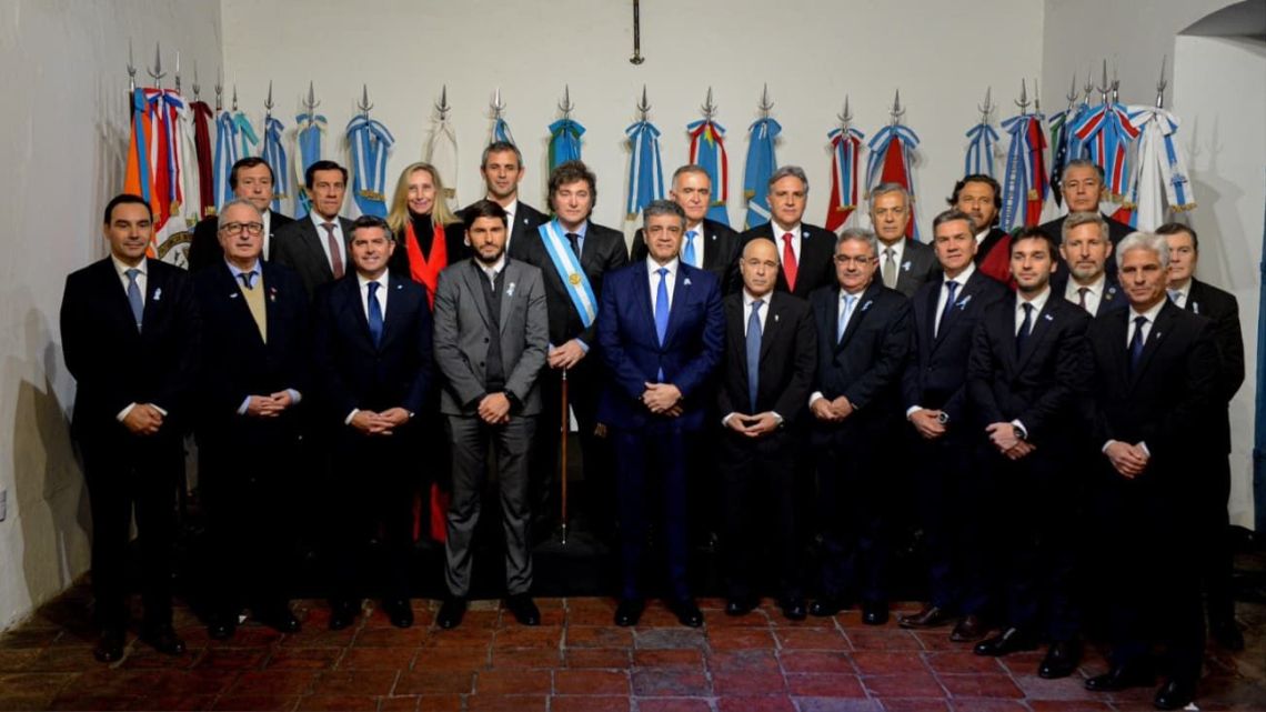 President Javier Milei poses for a photograph with 18 provincial governors and the mayor of Buenos Aires City after signing the 'Acto de Mayo' or 'May Pact' at San Miguel de Tucumán in the early hours of July 9, 2024.