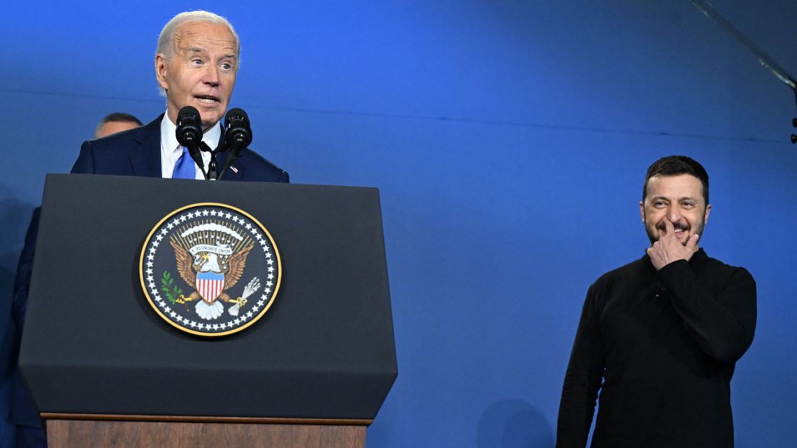 US President Joe Biden corrects himself after accidentally introducing Ukraine's President Volodymyr Zelensky as Russia's President Vladimir Putin during the Ukraine Compact initiative on the sidelines of the NATO Summit at the Walter E. Washington Convention Center in Washington, DC, on July 11, 2024. 